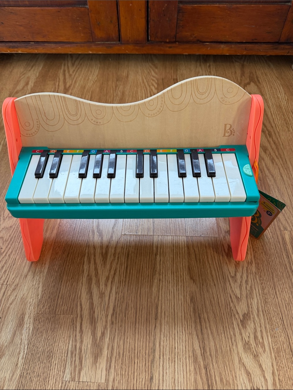 B Toys Mini Maestro Wooden Toy Piano in Teal and Coral